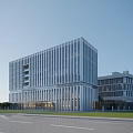 Modern Multi Storey Office Building With White Exterior Large Glass Windows And Green Lawn Trees