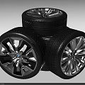 Stacked Car Tires With Stylish Metallic Wheel Rims And Tread Pattern Design