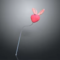 Decorative Pink Heart With Pink Wings On White Slender Stick Against Gray Background