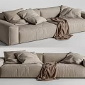 Light Brown Two Seater Sofa With Throw Pillows And Cozy Blanket