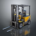 Yellow And Gray Industrial Forklift With Front Forks And Driver Cab