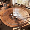Round Wooden Dining Table Featuring Glass Turntable White Coasters and Wooden Chairs with Natural Light