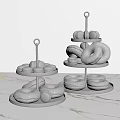 Two Tiered Dessert Stands With Colorful Donuts And Macarons On Marble Countertop