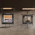 Elegant Wall Decor With Framed Artworks And Sconce Lighting On Wooden Panel