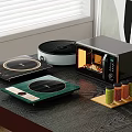 Modern Kitchen Countertop With Induction Cooktops Microwave Oven And Spice Jars