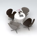 Stylish Leisure Chairs Around Round White Table With Pink Flowers And Book