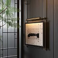 Black And White Landscape Painting On Dark Wooden Wall With Strip Light And Green Plant
