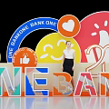Vibrant ONE BANK ONE Photo Check-in Spot with Colorful Letters Smiley Heart and Thumbs-up Icons