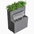 Modern Garden Accent Featuring Black Water Fountain Structure With Green Plants And Flowing Water
