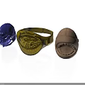 Decorative Ornaments Including Blue Helmet Gold Dragon Ring And Brown Creature Head