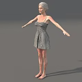 Woman in black and white checkered dress with arms outstretched standing against gray background barefoot