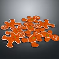 Freshly Baked Gingerbread Men Cookies Orange with White Icing Edges and Green Decorations