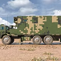 Military Camouflage Functional Vehicle With Antenna And Equipment In Desert Terrain