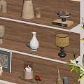 Stylish Decorative Ornament Collection On Wooden Shelves With Vase Candle Holder And Green Plant