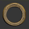Intricately Carved Golden Ring Sculpture With Detailed Engravings And Decorative Patterns