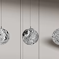 Modern Pendant Lights With Moon Like Cratered Texture Hanging In Minimalist Interior