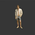 Man In Light Cardigan And Shorts Standing Against Gray Background With Floor Reflection
