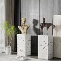 Artistic Bust And Horse Sculptures On Concrete Pedestals With Wooden Wall And Potted Plant