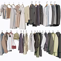 Clothes Hanging On Hangers With Various Styles Assorted Colors And Red Bag