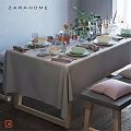 Elegant Tableware Set With Green White Plates Bowls Glasses Pink Striped Napkins On Gray Tablecloth