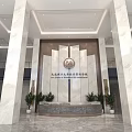 School Lobby Interior With Marble Walls Emblem Plants And Reception Desk