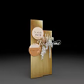 Golden Display Structure With DE LA PAIX Branding Circular Accent And Metallic Finish