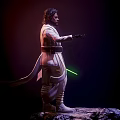 Iconic Star Wars Film Character Luke Skywalker In White Robe Holding Green Lightsaber On Rock