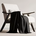 Modern Minimalist Leisure Chair With Light Fabric Seat Dark Wooden Armrests And Cozy Blanket
