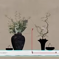Rustic Floral Arrangements in Two Dark Vases with Green Branches Pink Blooms on Wooden Table