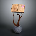 Antique Open Book Display With Branch Like Wooden Stand And Gray Stone Vase Base