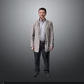 Standing Man In Light Coat And Shirt With Dark Pants Against Gray Background