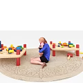 Two Kids Tables with Colorful Blocks and Child Playing on a Rug