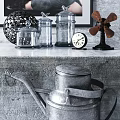 Modern Gray Console Table With Glass Jars Decorative Sphere Clock Windmill And Watering Can