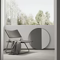 Modern Leisure Chair with Gray Blanket and Round Mirror by Window with Trees