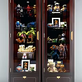 Display Cabinet Shelves With Teddy Bears Panda Dolls Robots Spider Toys And Photo Frames