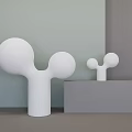 Two White Floor Lamps With Rounded Globes In Modern Light Green And Gray Wall Interior