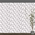 White 3D Geometric Pattern Wall Panels With Decorative Green Plant In Modern Interior 3d model