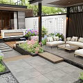 Modern Garden Design With Outdoor Sofas Coffee Table Colorful Flowers And Stone Pavement