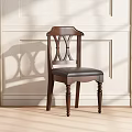 Classic Wooden Dining Chair With Carved Backrest And Leather Seat Against Light Colored Wall