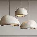 Modern Hemispherical Pendant Lights With Textured Ivory Shade Hanging Over Neutral Wall