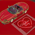 Pink Convertible Sports Car on Red Background with Valentine's Day Heart Decoration