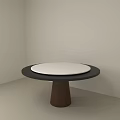 Round Dining Table With White Tabletop And Dark Wooden Base In Minimalist Room