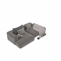 Modern Sectional Sofa with Beige Upholstery Decorative Pillows Round Bolsters and Knit Blanket