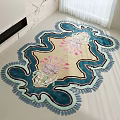 Unique Shaped Decorative Area Rug With Beige Base Blue Edges And Pink Floral Design