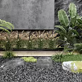 Modern Courtyard Garden Featuring Gray Wall Black Gravel Tall Plants Stones And Lanterns