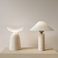 Two Modern Table Lamps With Stone Bases And Different Shade Designs On Light Table 3d model