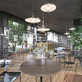Modern Restaurant Outdoor Dining Space With Warm Lighting Green Plants And Cobblestone Pavement