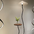 Curved Floor Lamps With White Light Strips And Small Table Indoor