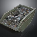 Green Metal Trash Container Filled With Mixed Waste And Debris