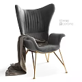 Gray Velvet Wingback Accent Chair With Gold Metal Legs And Draped Blanket
